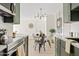 Bright dining area with a four-person table and chairs, adjacent to the kitchen at 7350 N Via Paseo Del Sur -- # P202, Scottsdale, AZ 85258