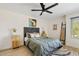 Spacious bedroom with queen bed, ceiling fan, and built-in shelving at 7350 N Via Paseo Del Sur -- # P202, Scottsdale, AZ 85258