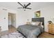 Large bedroom with queen bed, ceiling fan, and access to hallway at 7350 N Via Paseo Del Sur -- # P202, Scottsdale, AZ 85258