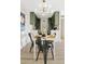 Bright dining area with a modern kitchen and stylish light fixture at 7350 N Via Paseo Del Sur -- # P202, Scottsdale, AZ 85258