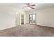 Spacious bedroom with carpet and access to balcony at 15818 N 25Th St # 112, Phoenix, AZ 85032