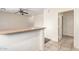 Kitchen with breakfast bar and access to hallway at 15818 N 25Th St # 112, Phoenix, AZ 85032