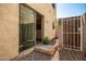 Small backyard with a gate and sliding glass door access at 15818 N 25Th St # 112, Phoenix, AZ 85032