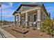 Craftsman style home with brick facade, front porch, and landscaped yard at 1165 E Gleneagle Dr, Chandler, AZ 85249