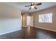 Well-lit bedroom with hardwood floors and ceiling fan at 5335 E Shea Blvd # 1042, Scottsdale, AZ 85254