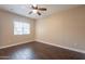 Spacious bedroom with hardwood floors and large window at 5335 E Shea Blvd # 1042, Scottsdale, AZ 85254