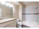 Bathroom with tub, shower, granite countertop, and tiled floors at 5335 E Shea Blvd # 1042, Scottsdale, AZ 85254