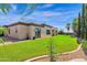 House exterior showcasing a side view and a green lawn at 17903 W Solano Dr, Litchfield Park, AZ 85340