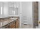 Bathroom with granite countertop and storage at 17903 W Solano Dr, Litchfield Park, AZ 85340