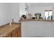 Home wet bar with granite countertop and wooden cabinetry at 17903 W Solano Dr, Litchfield Park, AZ 85340