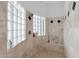 Walk-in shower with glass block windows and tiled walls at 17903 W Solano Dr, Litchfield Park, AZ 85340