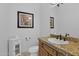 Bathroom with granite countertop and pedestal sink at 17903 W Solano Dr, Litchfield Park, AZ 85340