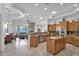 Gourmet kitchen boasts ample cabinetry, an island, and stainless steel appliances at 17903 W Solano Dr, Litchfield Park, AZ 85340