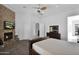 Relaxing bedroom with fireplace and built-in shelving at 17903 W Solano Dr, Litchfield Park, AZ 85340