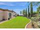 Landscaped backyard with grassy area at 17903 W Solano Dr, Litchfield Park, AZ 85340