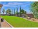 Landscaped backyard with grassy lawn and privacy wall at 17903 W Solano Dr, Litchfield Park, AZ 85340