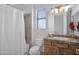 Clean bathroom with granite countertop and shower at 17903 W Solano Dr, Litchfield Park, AZ 85340