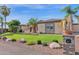 House exterior with manicured lawn and desert landscaping at 17903 W Solano Dr, Litchfield Park, AZ 85340