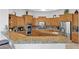 Modern kitchen with granite countertops and stainless steel appliances at 17903 W Solano Dr, Litchfield Park, AZ 85340