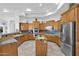 Open kitchen with granite countertops and double ovens at 17903 W Solano Dr, Litchfield Park, AZ 85340