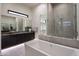 Spa-like bathroom featuring a freestanding tub and a large shower at 8332 E Sand Flower Dr, Scottsdale, AZ 85266