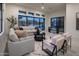 Gathering room with sectional sofa and access to backyard pool at 8332 E Sand Flower Dr # 20, Scottsdale, AZ 85266