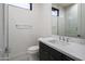 Modern bathroom with dark vanity and white tile at 8332 E Sand Flower Dr # 20, Scottsdale, AZ 85266