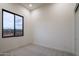 Simple bedroom with a large window and neutral wall at 8332 E Sand Flower Dr # 20, Scottsdale, AZ 85266