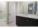 Modern bathroom with dark vanity and a shower at 8332 E Sand Flower Dr # 20, Scottsdale, AZ 85266