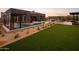 Expansive backyard with a pool, spa, and artificial turf at 8332 E Sand Flower Dr # 20, Scottsdale, AZ 85266