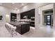 Modern kitchen with large island and dark cabinetry at 8332 E Sand Flower Dr # 20, Scottsdale, AZ 85266