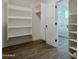 Spacious walk-in closet with built-in shelves and rods at 9462 E Mogollon Trl, Gold Canyon, AZ 85118