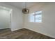 Bright dining area with hardwood floors and a large window at 9462 E Mogollon Trl, Gold Canyon, AZ 85118