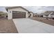 New construction home with a long driveway and desert landscaping at 9462 E Mogollon Trl, Gold Canyon, AZ 85118