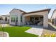 Relaxing backyard patio with artificial turf and covered seating area at 156 E Leverenz Ave, San Tan Valley, AZ 85140