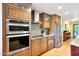 Modern kitchen features stainless steel appliances and ample wood cabinetry at 4452 E Lincoln Dr, Paradise Valley, AZ 85253
