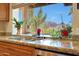 Kitchen sink with mountain views from the window at 4452 E Lincoln Dr, Paradise Valley, AZ 85253