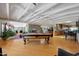 Home features a game room with pool table and open kitchen access at 4452 E Lincoln Dr, Paradise Valley, AZ 85253