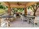 Outdoor kitchen and dining area with grills and seating at 2989 N 44Th St # 3036, Phoenix, AZ 85018