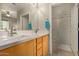 Double vanity bathroom with a large walk-in shower at 2989 N 44Th St # 3036, Phoenix, AZ 85018