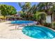 Relaxing community pool and spa with patio chairs at 2989 N 44Th St # 3036, Phoenix, AZ 85018