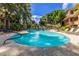 Inviting community pool with lounge chairs and lush landscaping at 2989 N 44Th St # 3036, Phoenix, AZ 85018