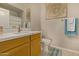 Clean bathroom with modern vanity and wood cabinets at 2989 N 44Th St # 3036, Phoenix, AZ 85018