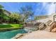 Scenic waterway with a cascading waterfall and lush landscaping at 2989 N 44Th St # 3036, Phoenix, AZ 85018