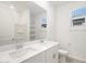 Double vanity bathroom with a large mirror at 37287 W Patterson St, Maricopa, AZ 85138