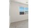 Bright dining area with large windows and grey tile flooring at 37287 W Patterson St, Maricopa, AZ 85138
