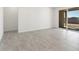 Spacious dining area with grey tile flooring and access to backyard at 37287 W Patterson St, Maricopa, AZ 85138