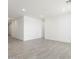 Spacious living room with grey tile floors and recessed lighting at 37287 W Patterson St, Maricopa, AZ 85138