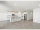 Open concept kitchen featuring stainless steel appliances and an island at 37287 W Patterson St, Maricopa, AZ 85138