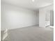 Spacious bedroom with grey carpet and access to bathroom at 37287 W Patterson St, Maricopa, AZ 85138